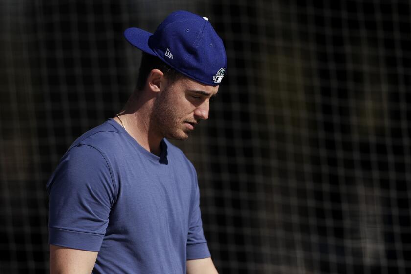 Dodgers outfielder Cody Bellinger leaves the batting cages during spring training Feb. 14 in Glendale, Ariz.