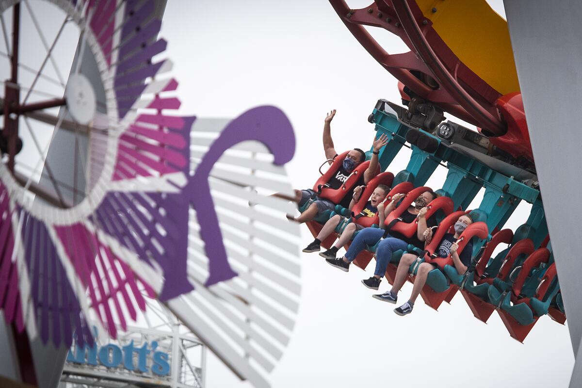 Buena Park, CA - May 29: Park-goers ride the Silver Bullet roller coaster during the re-opening day at Knott's Berry Farm to the full public and celebrate the 100th anniversary of the park after the easing of coronavirus pandemic restrictions Saturday, May 29, 2021 in Buena Park, CA.