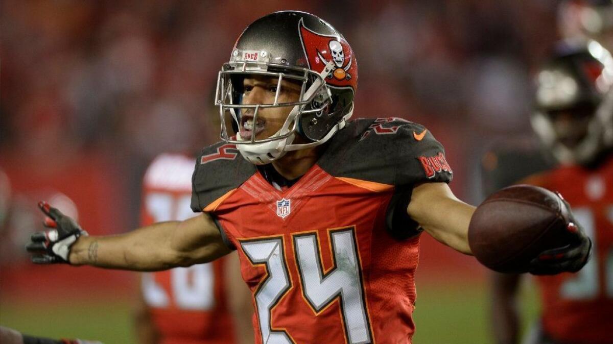 Buccaneers cornerback Brent Grimes celebrates after intercepting a pass from Saints quarterback Drew Brees during a game on Dec. 11.