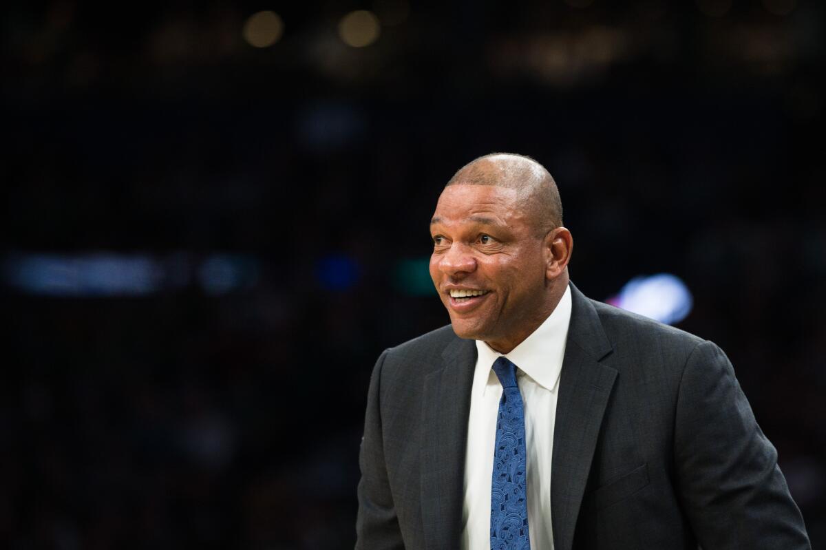 Clippers coach Doc Rivers smiles during a game against the Boston Celtics in February.