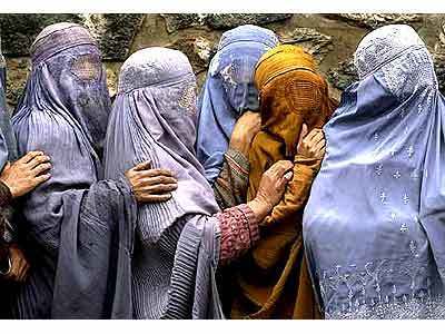 Women continue to wear burkas in public