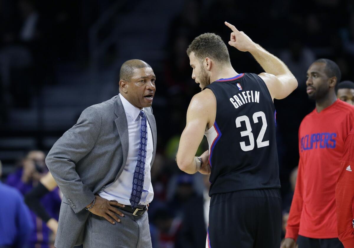 Clippers Coach Doc Rivers talks with Blake Griffin during a game against Detroit on Dec. 14.