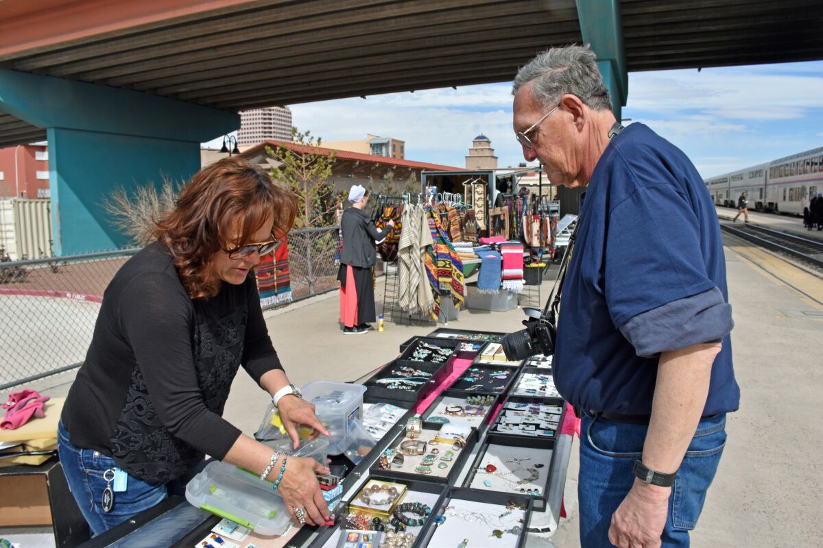 Veronica Yellowhorse shows her jewelry in Albuquerque during a Southwest Chief stop.