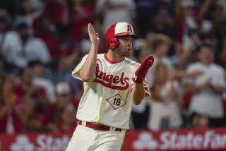 Los Angeles Angels' Nolan Schanuel celebrates after scoring on a double by Brandon Drury.