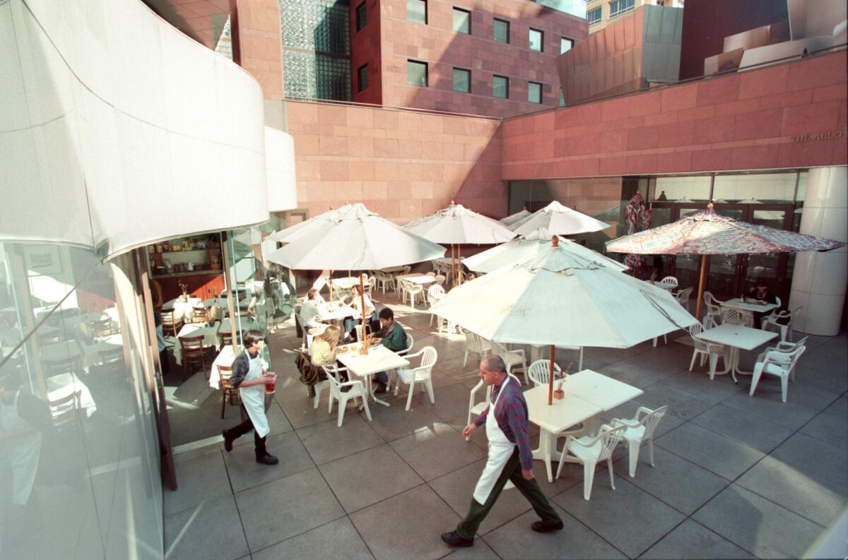 A 1996 view of MOCA's below-street courtyard in where a café shares the space with the museum entrance.