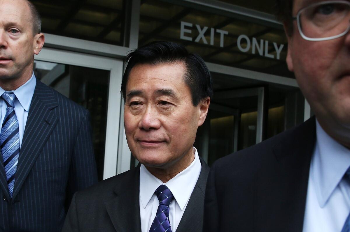 State Sen. Leland Yee leaves San Francisco's Phillip Burton Federal Building after a court appearance in connection with political corruption and firearms trafficking charges.