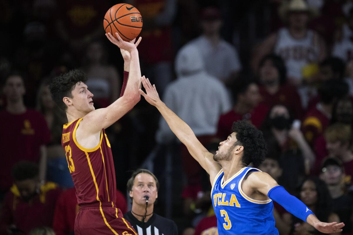 USC's Drew Peterson shoots over UCLA's Johnny Juzang on Feb. 12, 2022.