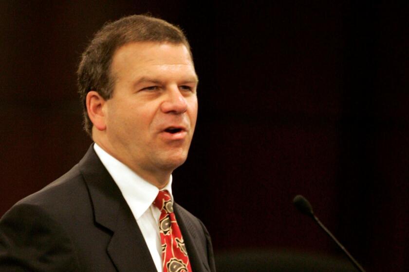 Tilman Fertitta, chairman of Landry's Restaurants Inc., gives a presentation during a Nevada Gaming Commission meeting in Las Vegas, Tuesday, Sept. 27, 2005. The commission approved the sale of the Golden Nugget casinos to Landry's Restaurants Inc., marking the company's first foray into the highly competitive gambling industry. (AP Photo/Jae C. Hong)