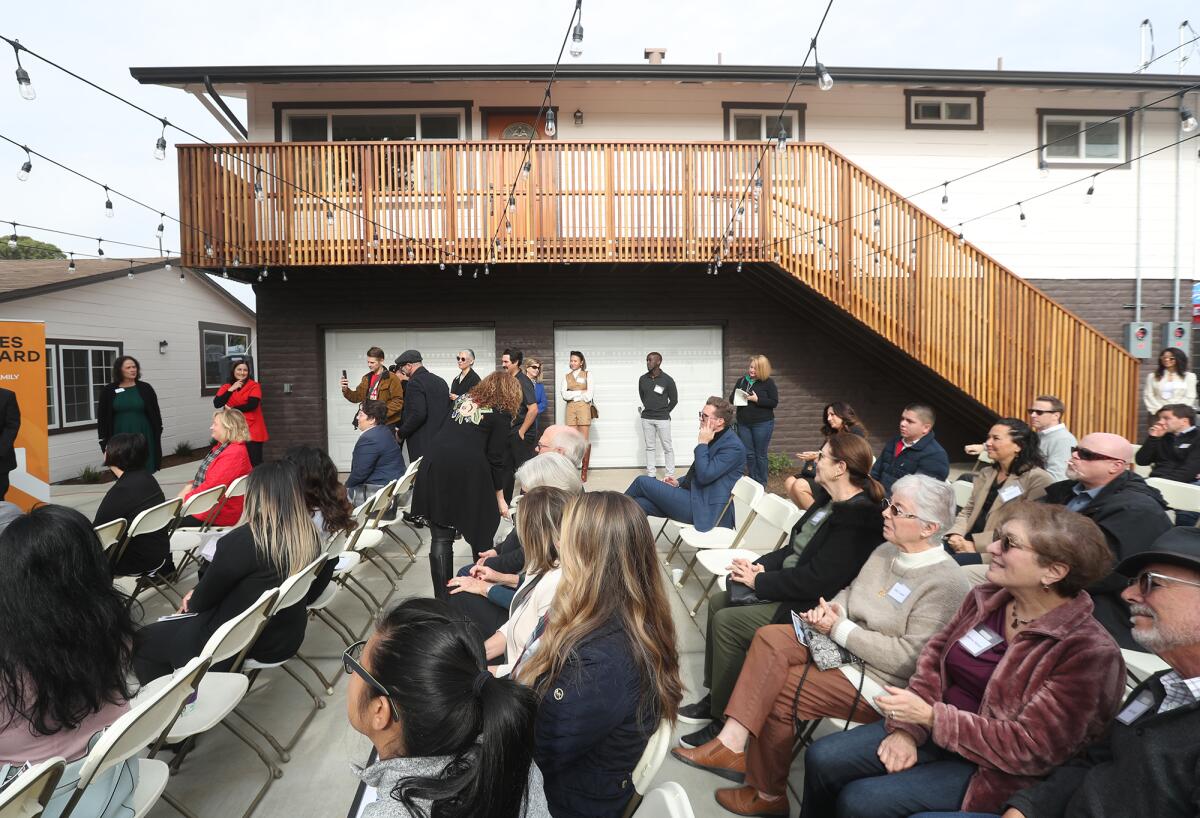 Guests, officials, and partners attend a dedication for The Bungalows, hosted by Families Forward and HomeAid Orange County.