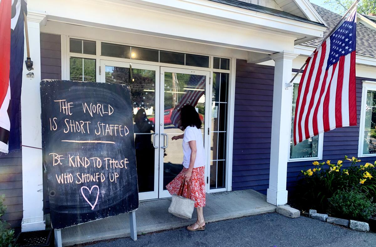 A woman enters a short-staffed bakery in Lincoln, Maine.