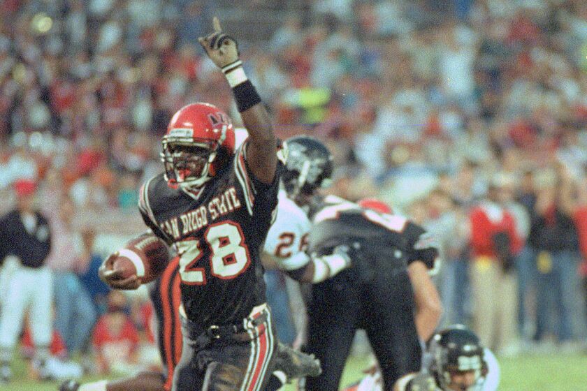 Aztecs freshman Marshall Faulk scores one of his seven touchdowns vs. Pacific on Sept. 14, 1991. Faulk rushed for 386 yards.