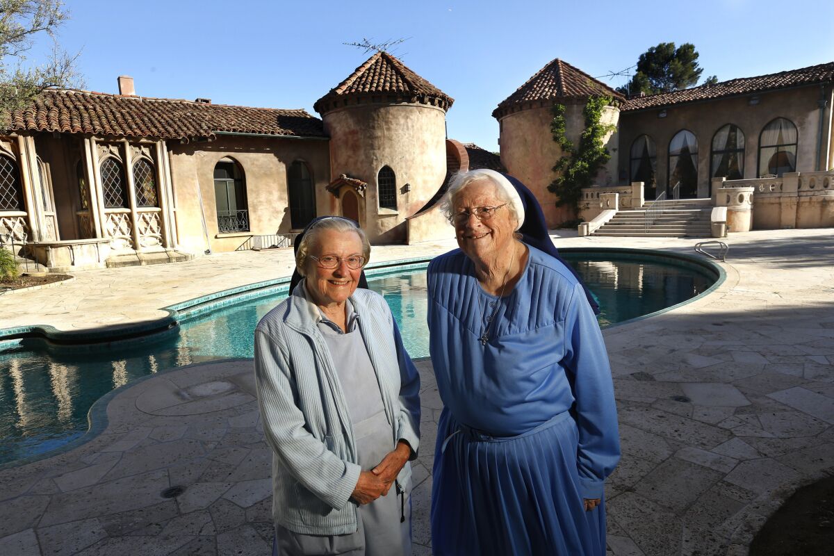 Sister Catherine Rose, left, and Sister Rita Callanan at the Sisters of the Immaculate Heart of Mary retreat in Los Feliz in 2015. The order made a deal to sell the property to restaurateur Dana Hollister, but the Archdiocese of Los Angeles says that only it has the authority to sell the property, which it intends to do to singer Katy Perry.