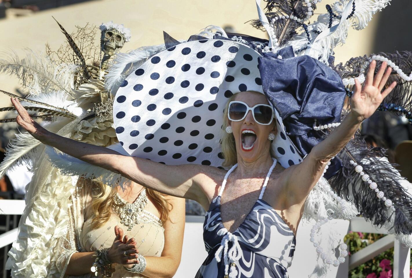 Belinda Berry, from Walnut Creek, celebrates after it was announced she had won the Grand Prize for her hat she calls "Go Navy".