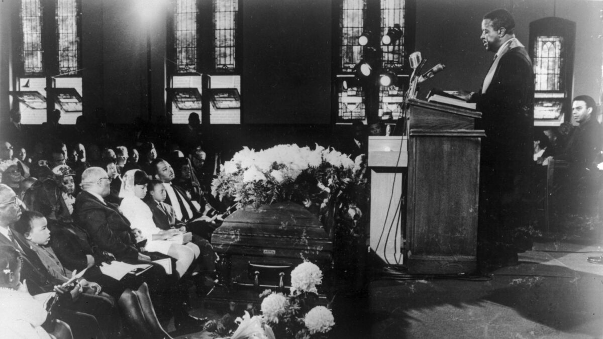 Clergyman and civil rights leader Ralph Abernathy presides over the funeral of slain civil rights leader Martin Luther King in 1968.