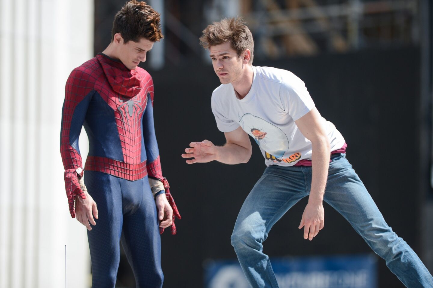 Actor Andrew Garfield, right, rehearses a scene with his stunt double William Spencer on the "The Amazing Spiderman 2" movie set in Madison Square Park in New York.