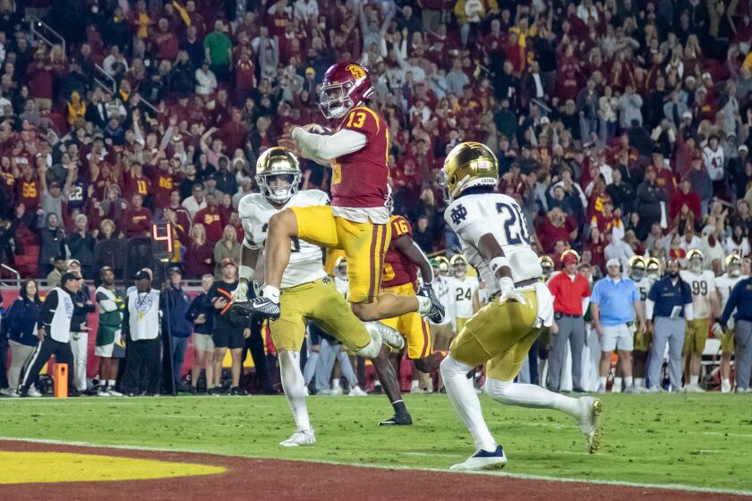 USC Trojans quarterback Caleb Williams scores his third touchdown of the game against Notre Dame.