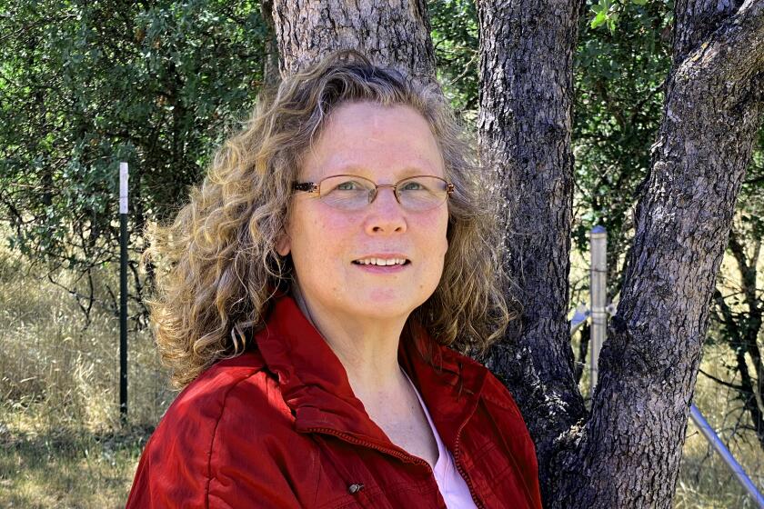 Cheri McKinzie, 58, was a marketing executive for Golden State Farm Credit in Chico, Calif. Along with her fellow employees, she worked from home beginning in Mar., 2020, after the Covid-19 pandemic struck. The company ordered workers to return to the office in July including McKinzie, whose doctor said she was "high risk" due to having most of her left lung removed after a bout of cancer seven years ago. In a lawsuit against the company, she said she was laid off after asking for an air filter, staggered workshifts and several other accomodations for her disability. For Margot Roosevelt back to the office story, May, 2021. (Cali McKinzie)