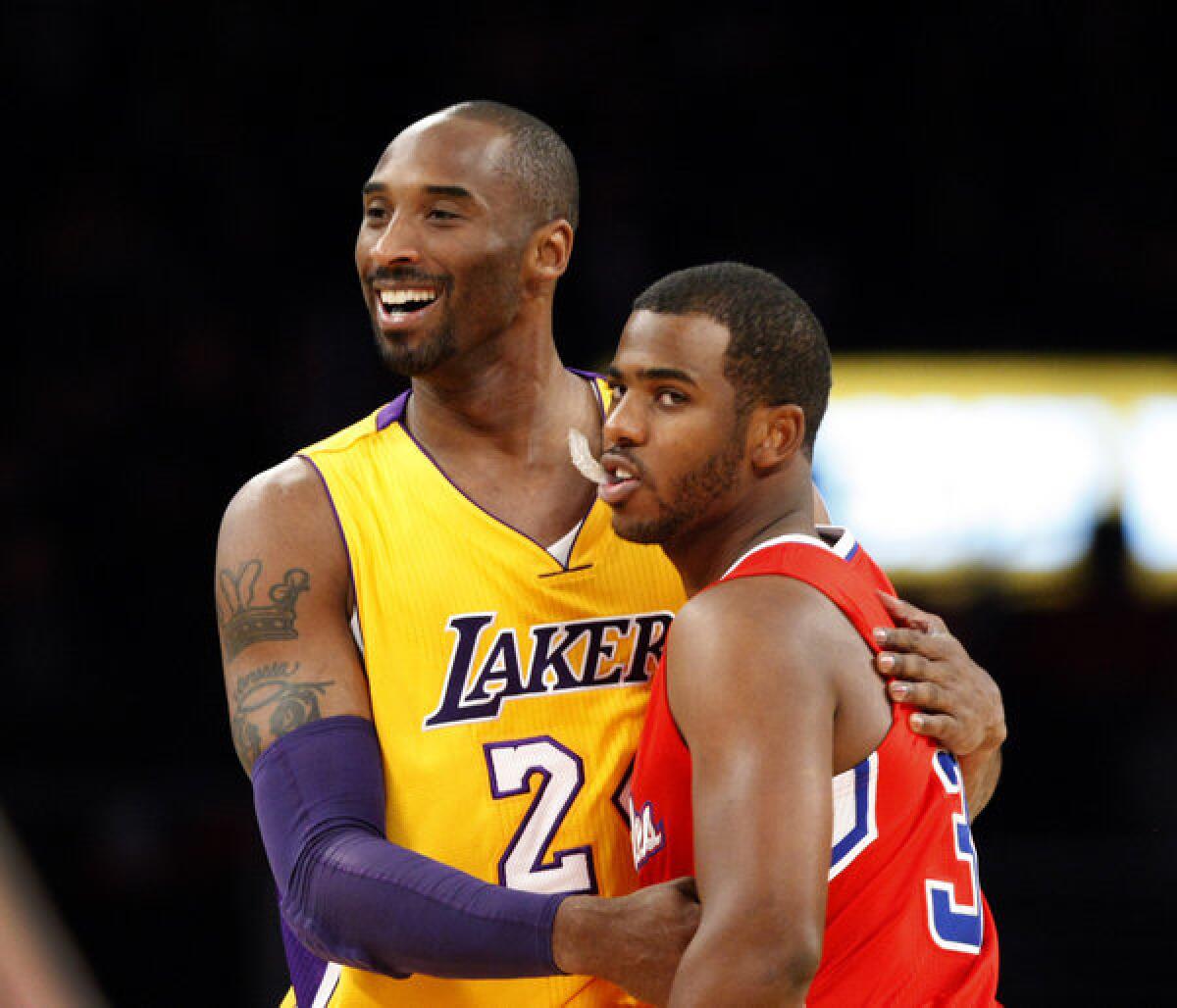 Lakers guard Kobe Bryant and Clippers guard Chris Paul embrace before a Nov. 6, 2013, exhibition game at Staples Center.