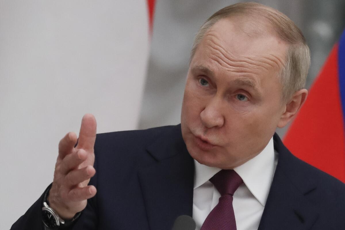 Russian President Vladimir Putin speaks during a news conference.