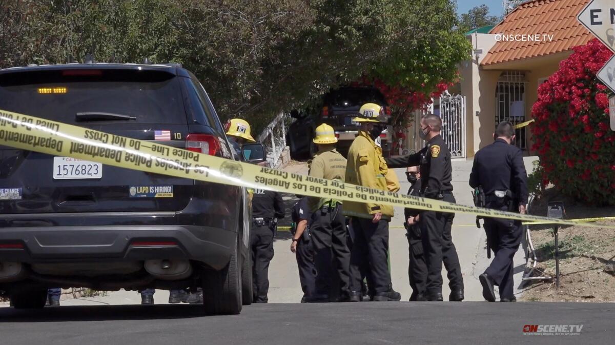 LAPD officers and firefighters at the scene of a homicide.