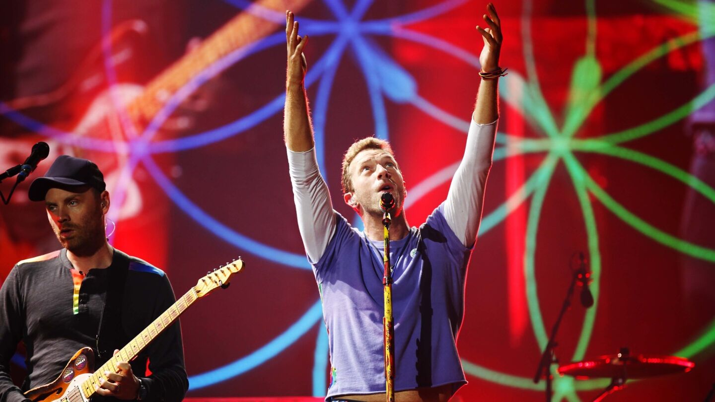 Chris Martin of Coldplay performs during the band's A Head Full of Dreams Tour at SDCCU Stadium on Oct. 8, 2017. (Photo by K.C. Alfred/The San Diego Union-Tribune)