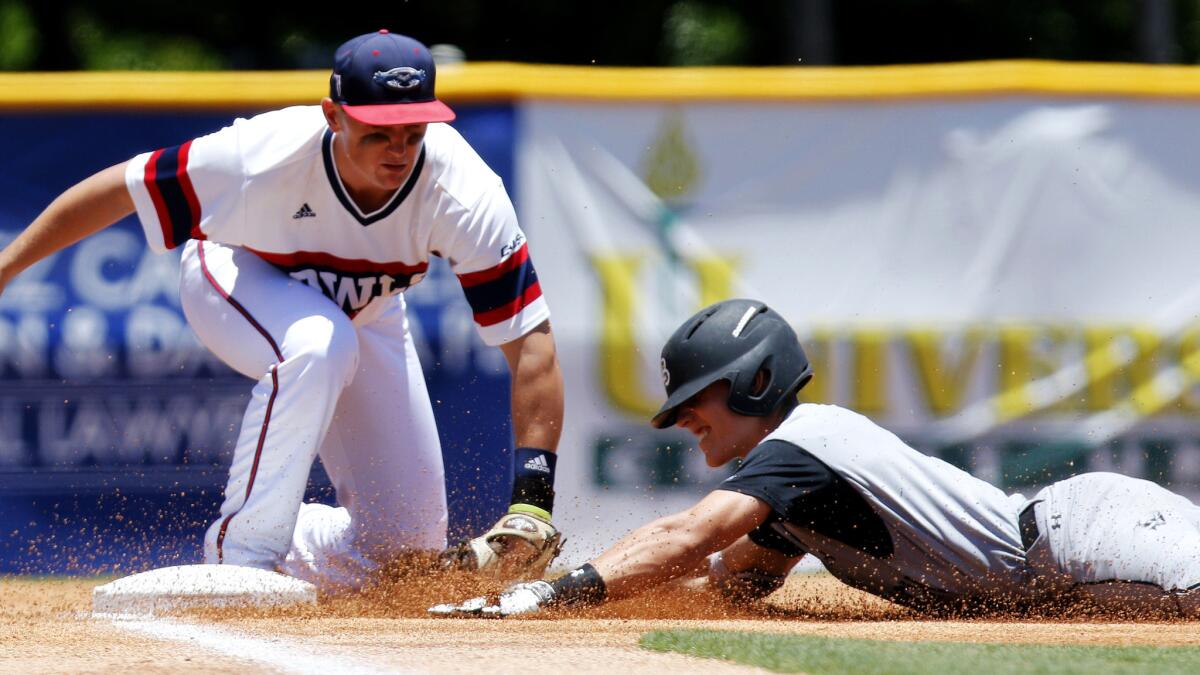 Florida Atlantic's Austin Langham tags out Long Beach State's Jarren Duran, who doubled in the first inning Friday but was thrown out trying to stretch it into a triple.