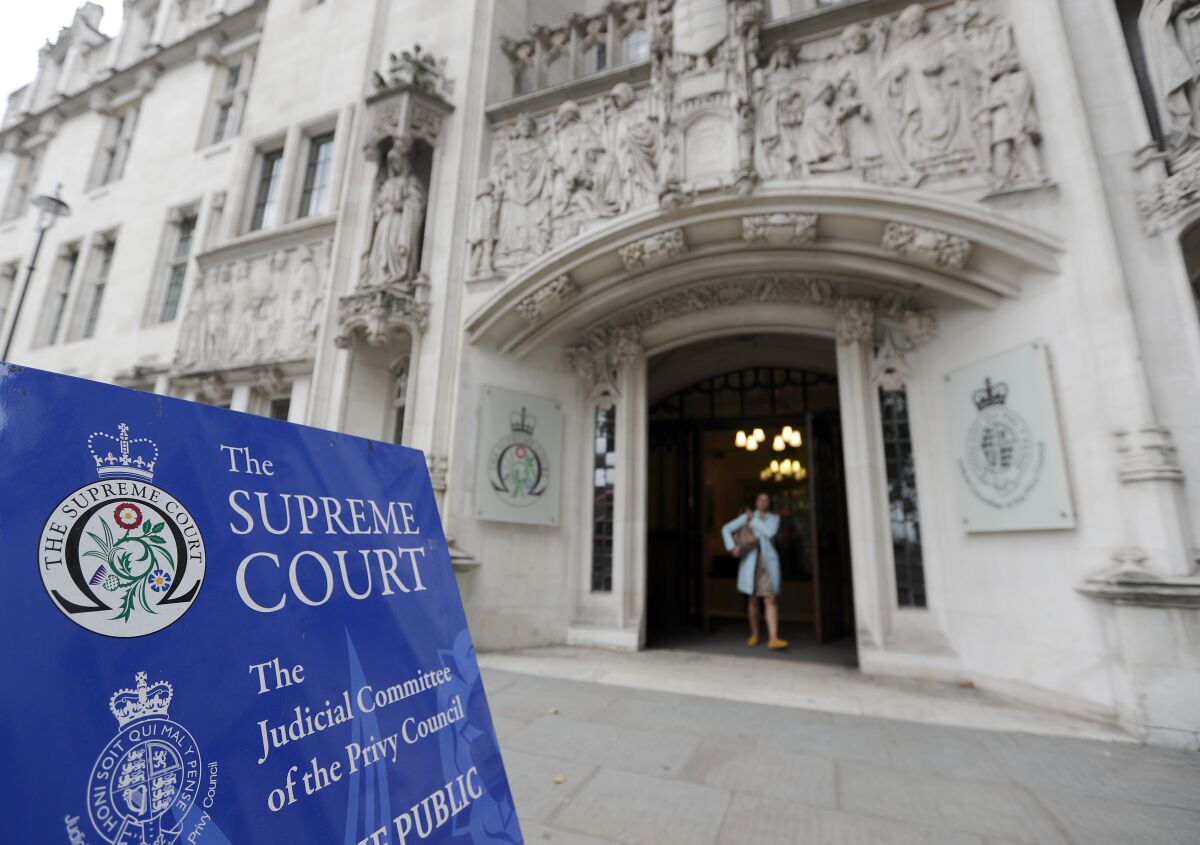 The entrance of the Supreme Court in London is seen in this Sept. 11, 2019 photo. Britain’s highest court has said that a businessman who was investigated over suspected fraud had a right to keep his identity private — a ruling media groups said would make it harder for journalists to expose crimes by the rich and powerful. The Supreme Court’s ruling that Bloomberg News had breached the businessman’s “reasonable expectation of privacy” is the latest U.K. court judgement to side with an individual’s right to privacy over the public’s right to know. (AP Photo/Frank Augstein)