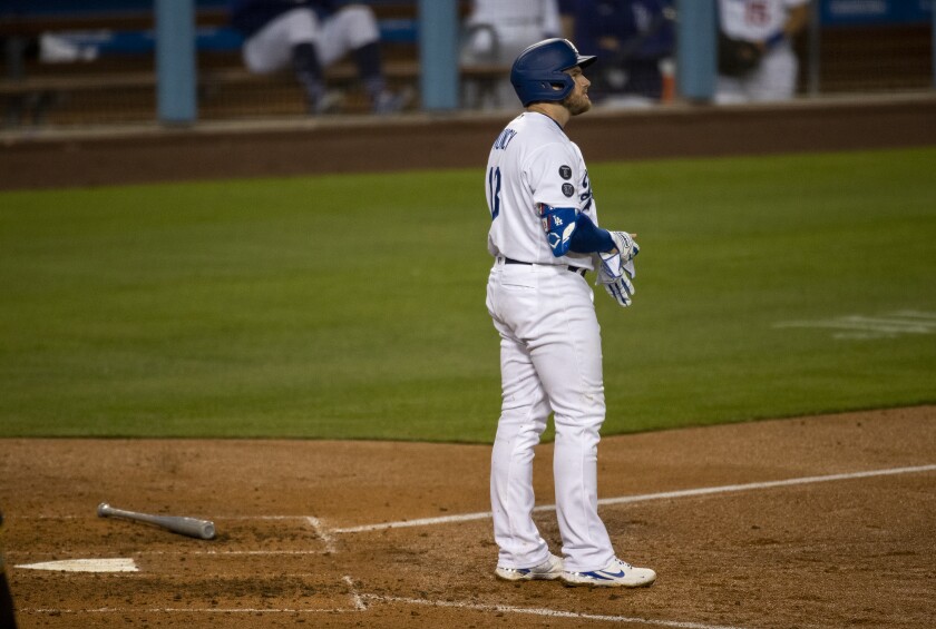 Dodgers first baseman Max Muncy stands at home plate after striking out.