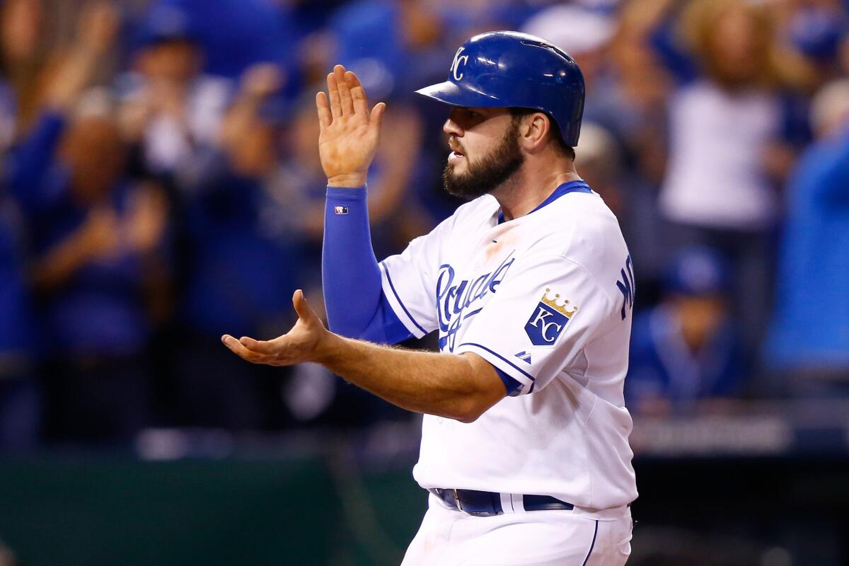 Royals third baseman Mike Moustakas celebrates after scoring a run in the seventh inning during Game 6 of the American League Championship Series.