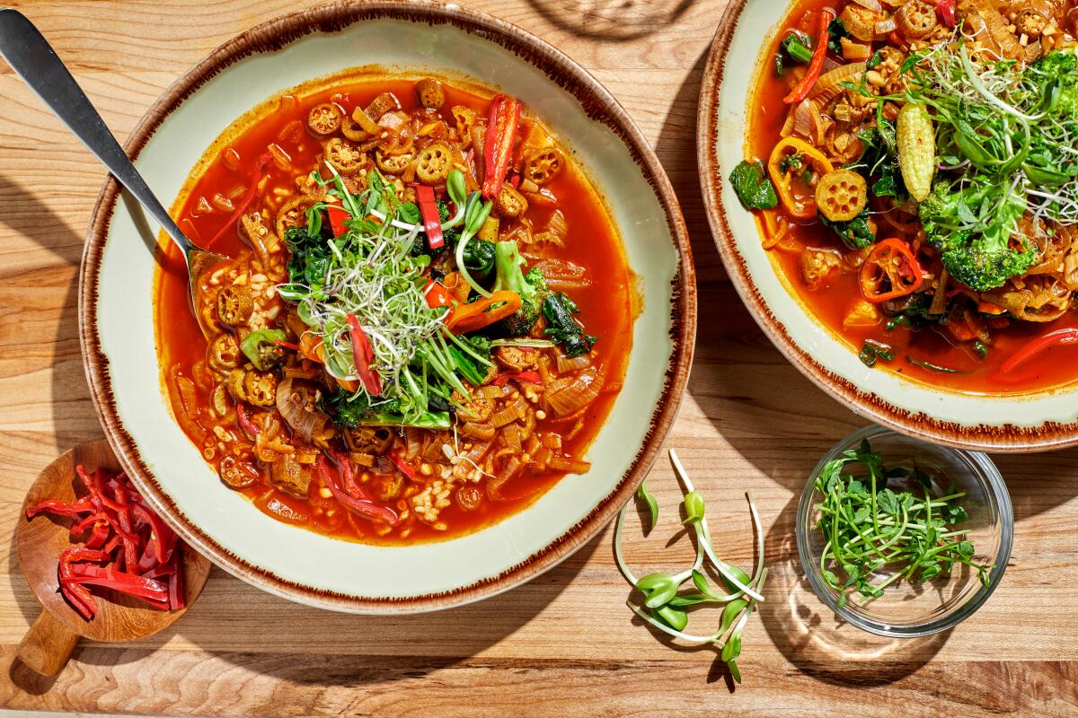 Chef Keith Corbin's vegetarian gumbo, in two bowls sitting on a wooden surface.