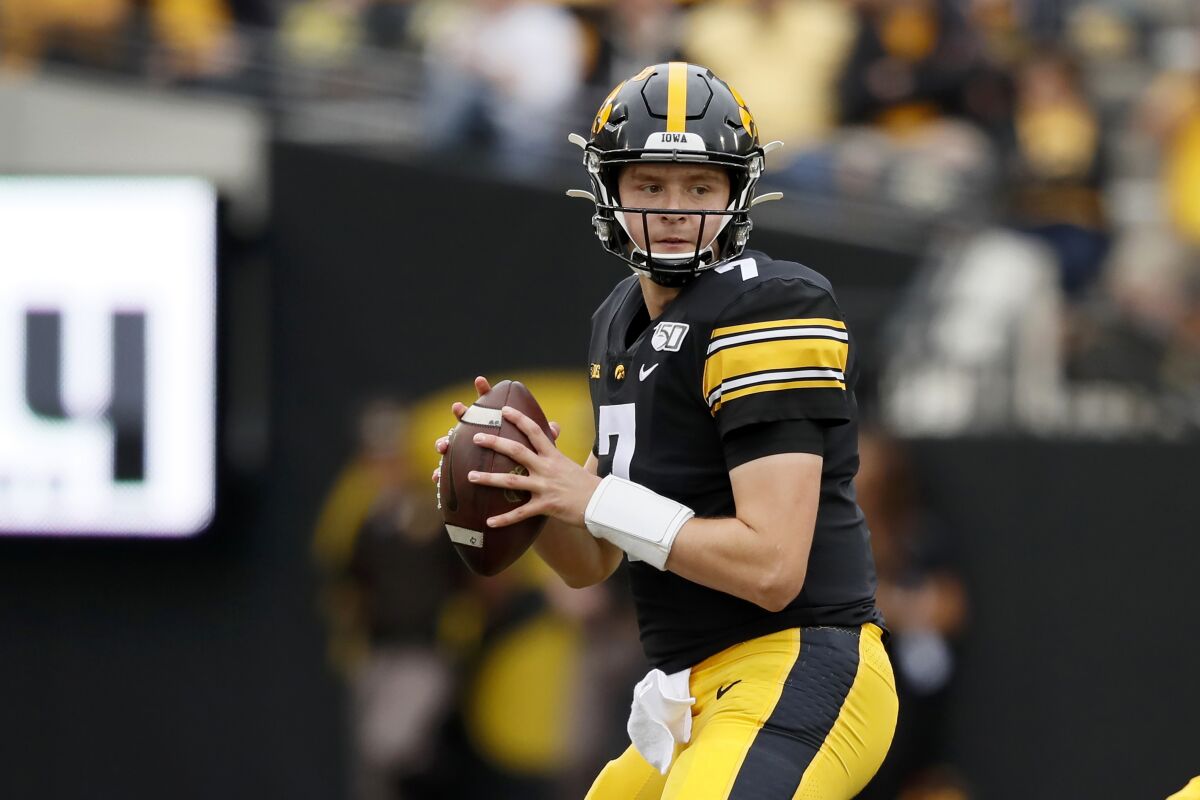 FILE - In this Sept. 28, 2019, file photo, Iowa quarterback Spencer Petras throws a pass during the second half of an NCAA college football game against Middle Tennessee in Iowa City, Iowa. Petras, who'll replace three-year starting quarterback Nate Stanley, couldn't walk into a much better situation. The 6-foot-5, 231-pound sophomore from San Rafael, California, will have plenty of experience around him at all positions, including what could be the best group of receivers in coach Kirk Ferentz's 22 seasons.(AP Photo/Charlie Neibergall, File)