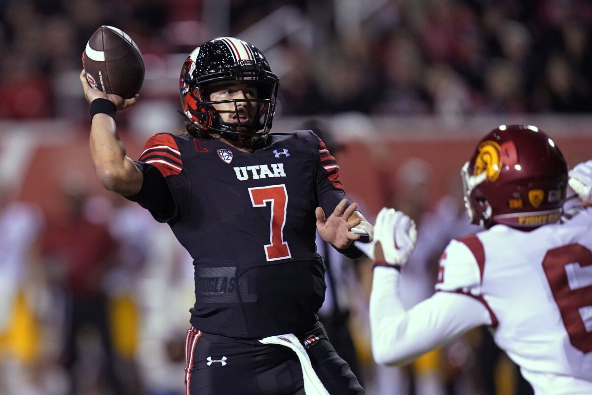 Utah quarterback Cameron Rising throws a pass against USC.