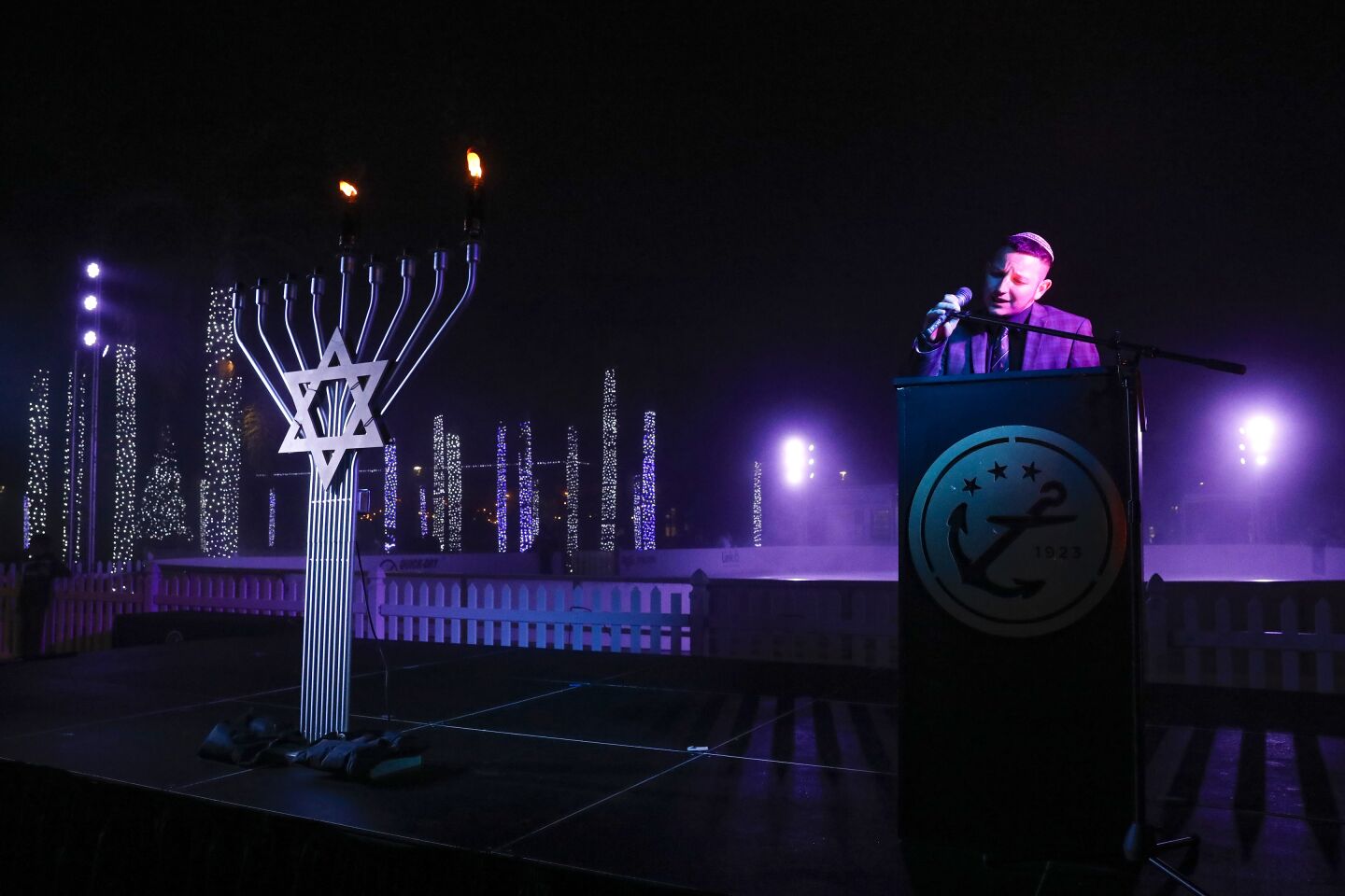 Gideon Friedman of Chabad of Downtown San Diego sings during Liberty Station’s menorah-lighting ceremony Nov. 28 in Point Loma.