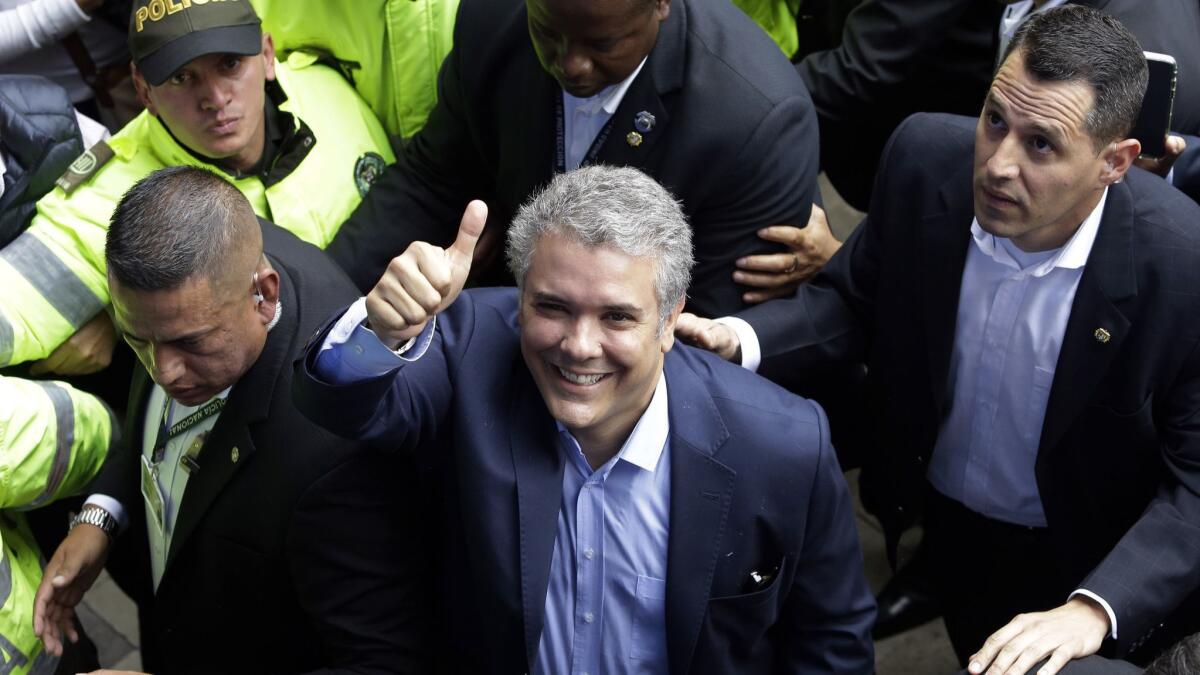 Ivan Duque, presidential candidate for the Democratic Center, gives a thumbs up after voting during the presidential election in Bogota, Colombia, on May 27, 2018.