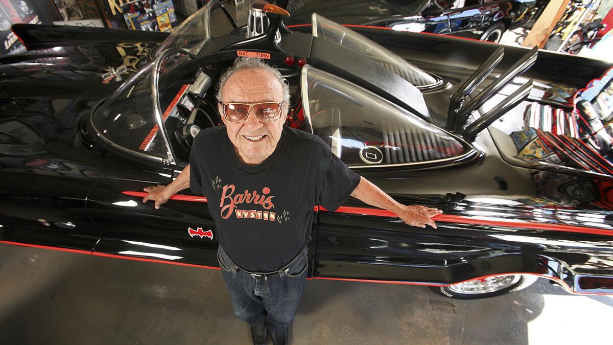 Car customizer George Barris stands next to the original Batmobile at Barris Kustom Industries in North Hollywood in 2012.