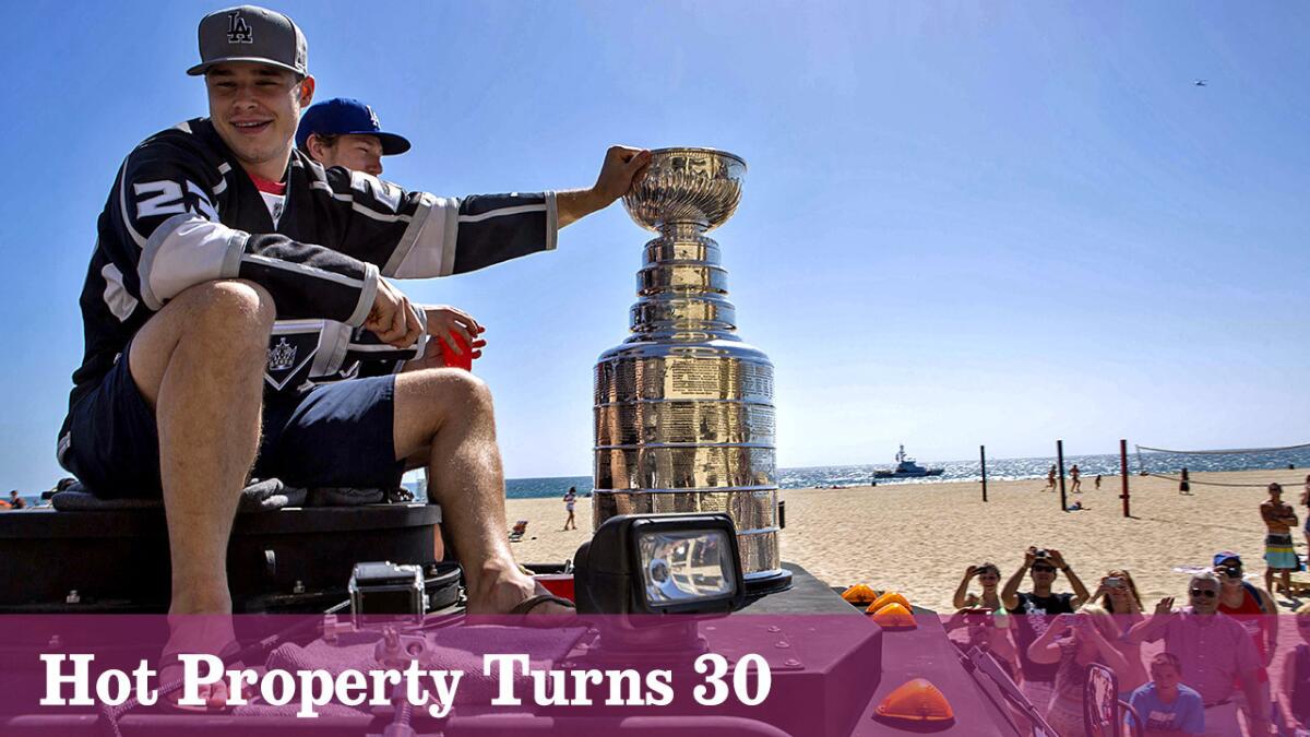 Dustin Brown and the Los Angeles Kings ride through Hermosa Beach during a Stanley Cup victory parade.