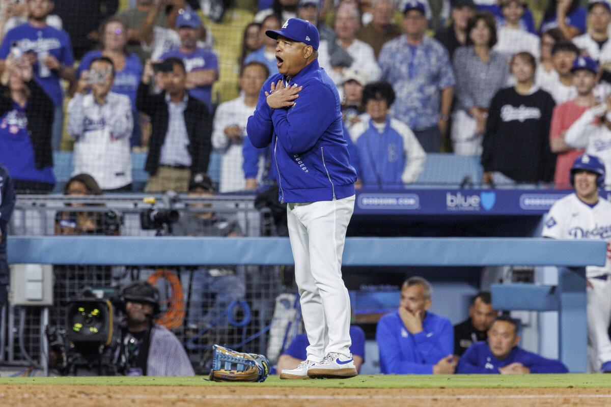 Dodgers manager gestures at Padres manager Mike Shildt after benches cleared in the ninth inning.