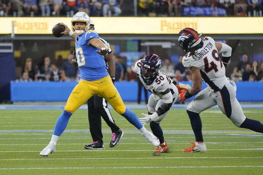Los Angeles Chargers quarterback Justin Herbert (10) throws against the Denver Broncos during the second half of an NFL football game Monday, Oct. 17, 2022, in Inglewood. (AP Photo/Marcio Jose Sanchez)