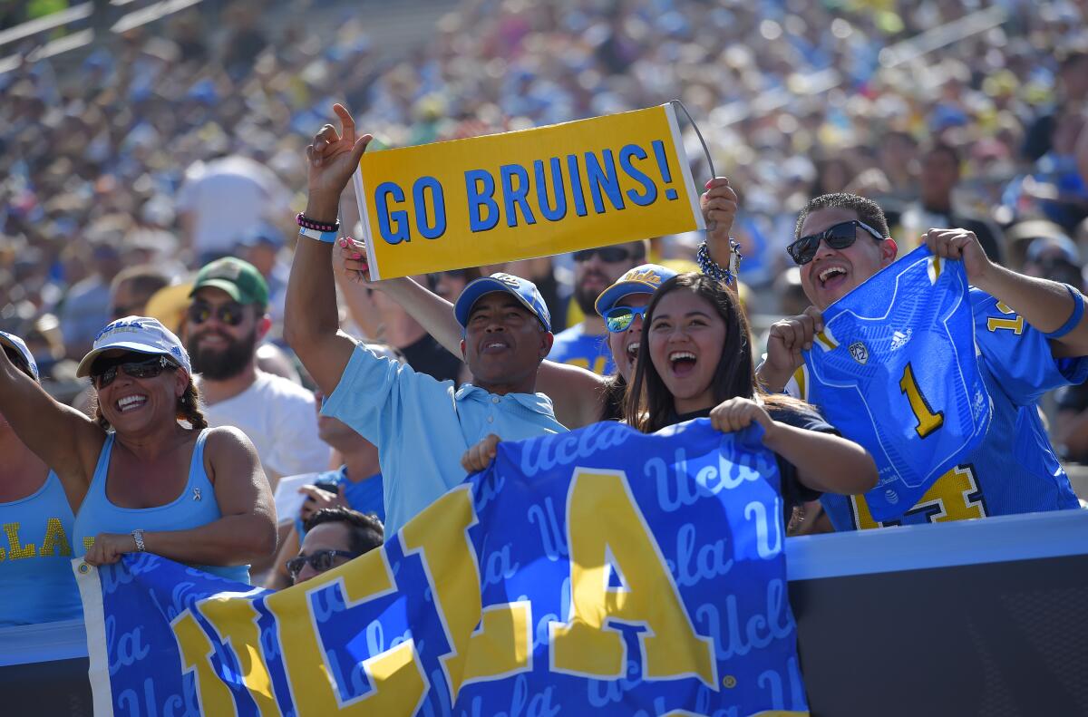 UCLA fans cheer during a game against Oregon at the Rose Bowl in 2014.