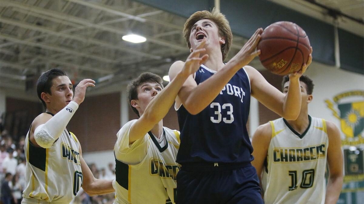 Newport Harbor's Robbie Spooner (33) scored all of his 17 points in the second half on Friday.