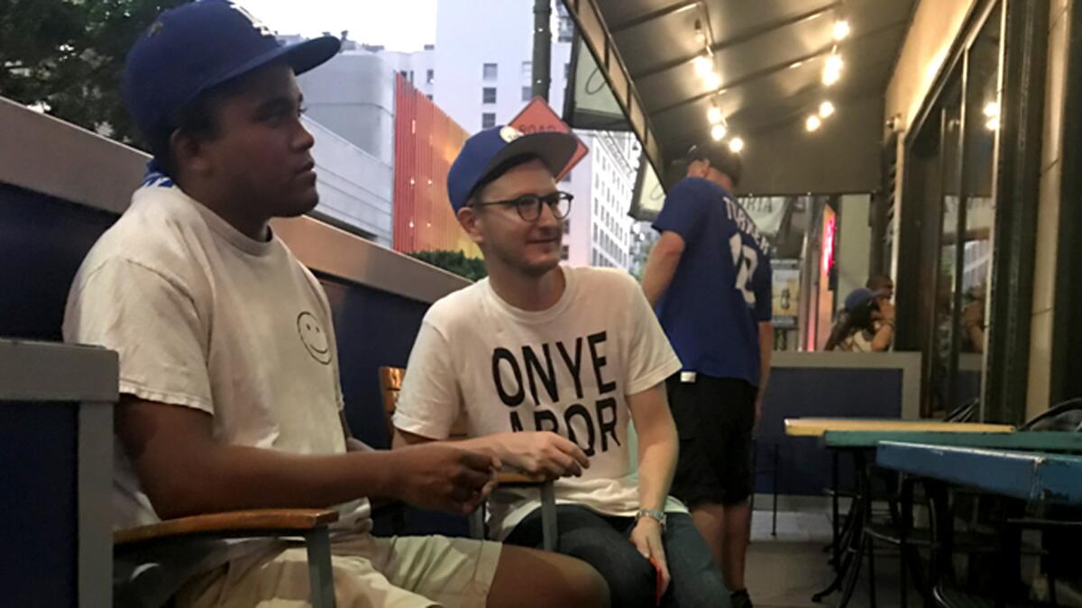 Natchez Fowler, left, and Shaun Koplow watch Game 1 of the World Series from The Down and Out bar patio.