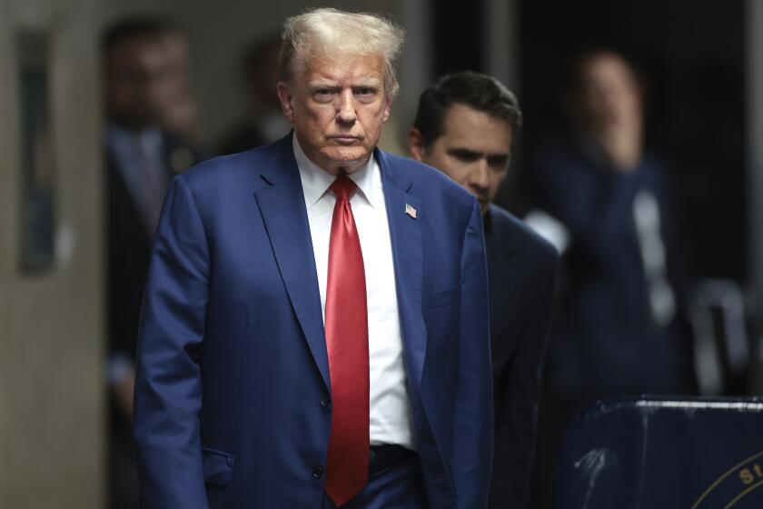 Former President Donald Trump walks to speak to reporters at Manhattan criminal court, Monday, May 6, 2024 in New York. (Win McNamee/Pool Photo via AP)