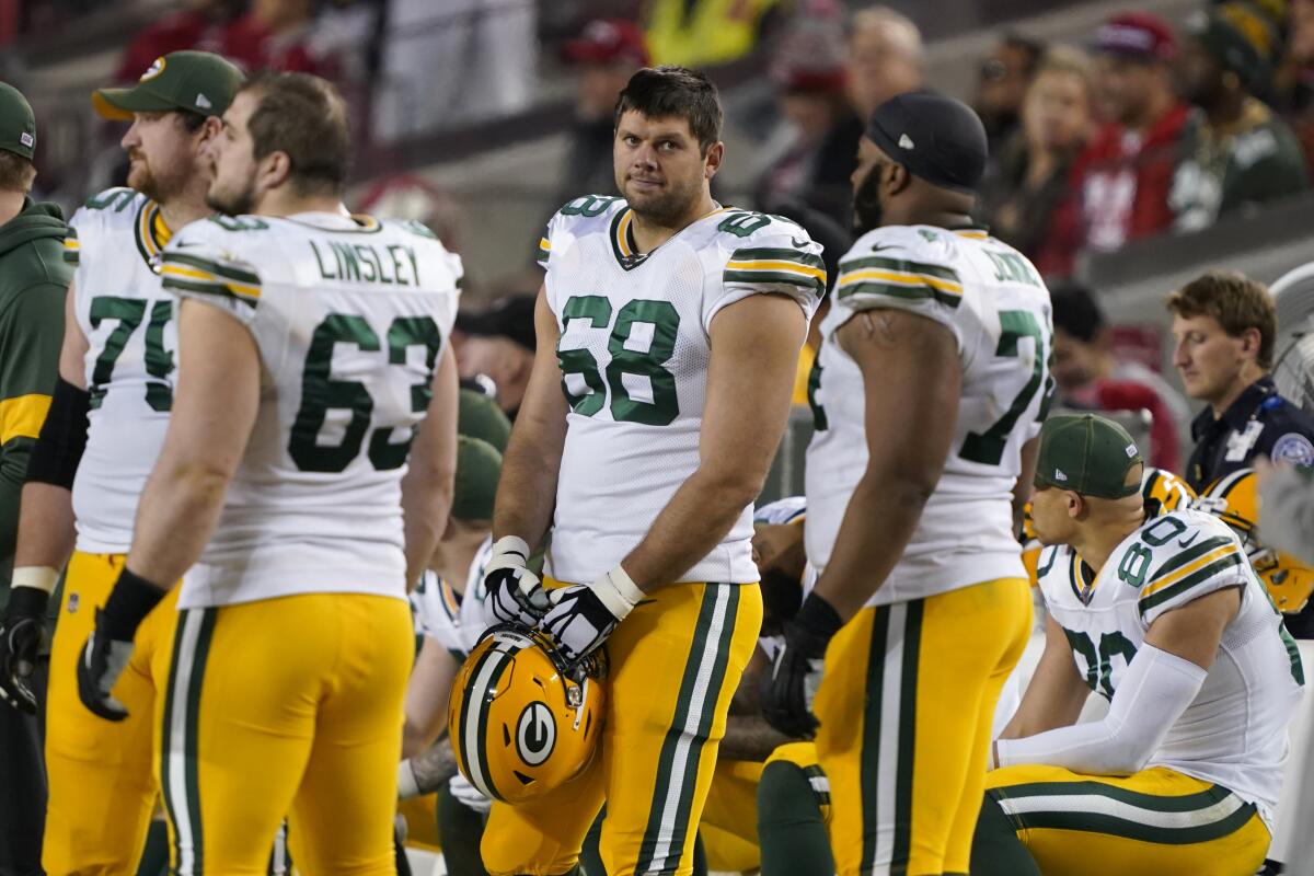 Green Bay Packers' Jared Veldheer (68) and teammates stand on the sideline during the second half of the NFL NFC Championship football game against the San Francisco 49ers Sunday, Jan. 19, 2020, in Santa Clara, Calif. Offensive tackle Jared Veldheer is back with the Green Bay Packers, giving him an opportunity to compete in playoff games for different teams on back-to-back weekends. Packers coach Matt LaFleur confirmed Tuesday, Jan. 12, 2021, that Veldheer was with the team and would be practicing later that day, making him available for their NFC divisional playoff game Saturday with the Los Angeles Rams (11-6). The 33-year-old Veldheer was the Indianapolis Colts’ starting left tackle for their final two games, including a 27-24 AFC first-round playoff loss to the Buffalo Bills last weekend. (AP Photo/Tony Avelar)