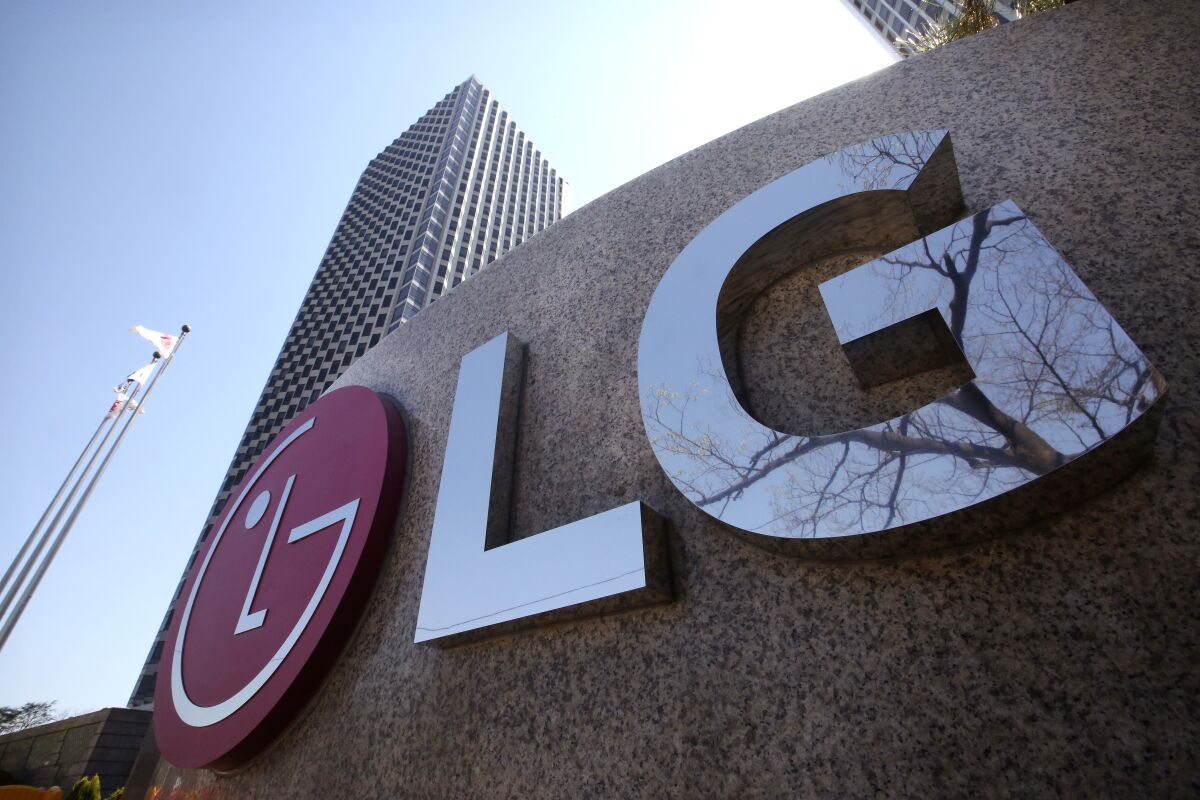 FILE - This April 5, 2021 file photo shows the logo of LG Electronics Inc. outside of the company's office building in Seoul, South Korea. LG Electronics has reached a deal with General Motors to pay as much as $2 billion to reimburse the automaker for the cost of recalling Chevrolet Bolt electric vehicles due to battery fires. The automaker announced the deal in a statement early Tuesday, Oct. 12. (AP Photo/Ahn Young-joon, File)
