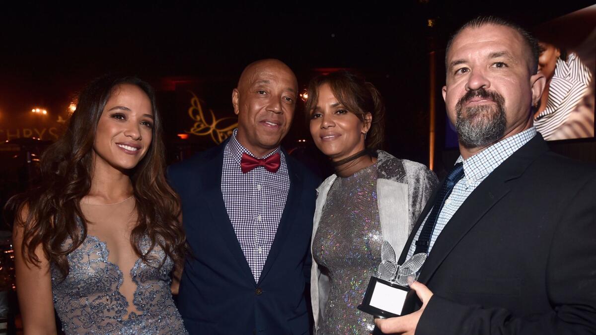 Dania Ramirez, from left, Russell Simmons, Halle Berry and honoree Raymond Davis. (Alberto E. Rodriguez / Getty Images for Chrysalis Butterfly Ball)