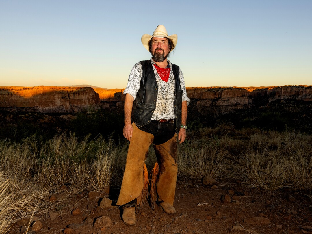 Hill stands on ranch land in Arizona.