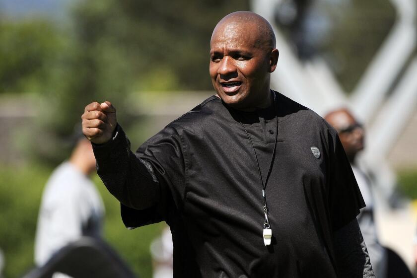 Hue Jackson coaches the Oakland Raiders in 2011.