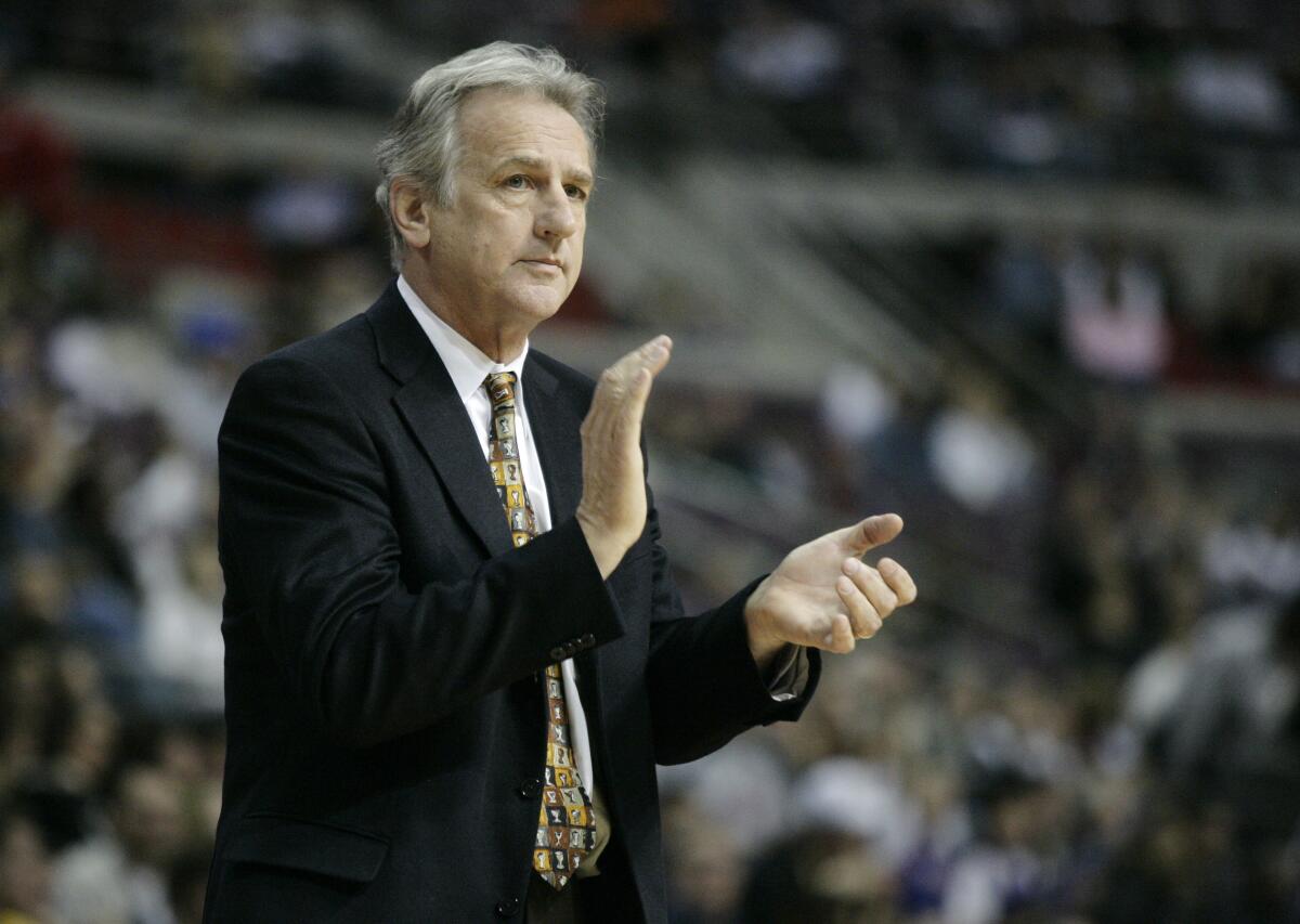 Paul Westphal coaches the Sacramento Kings against the Detroit Pistons.