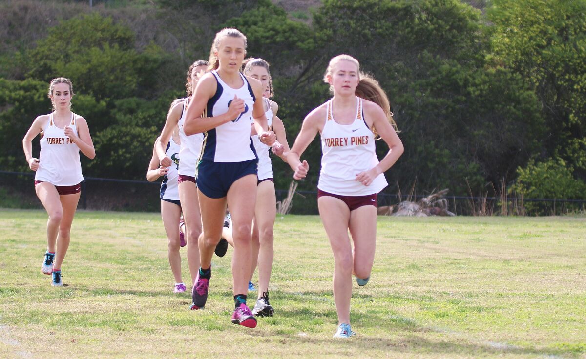 Kyra Compton (left) and Annika Salz pushed the pace in the early going of the girls' varsity race.