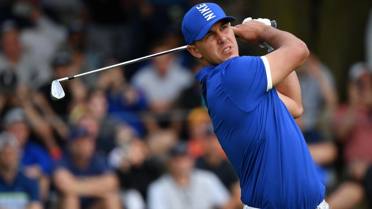 Brooks Koepka watches his tee shot at No. 17 during the second round of the PGA Championship on Friday.